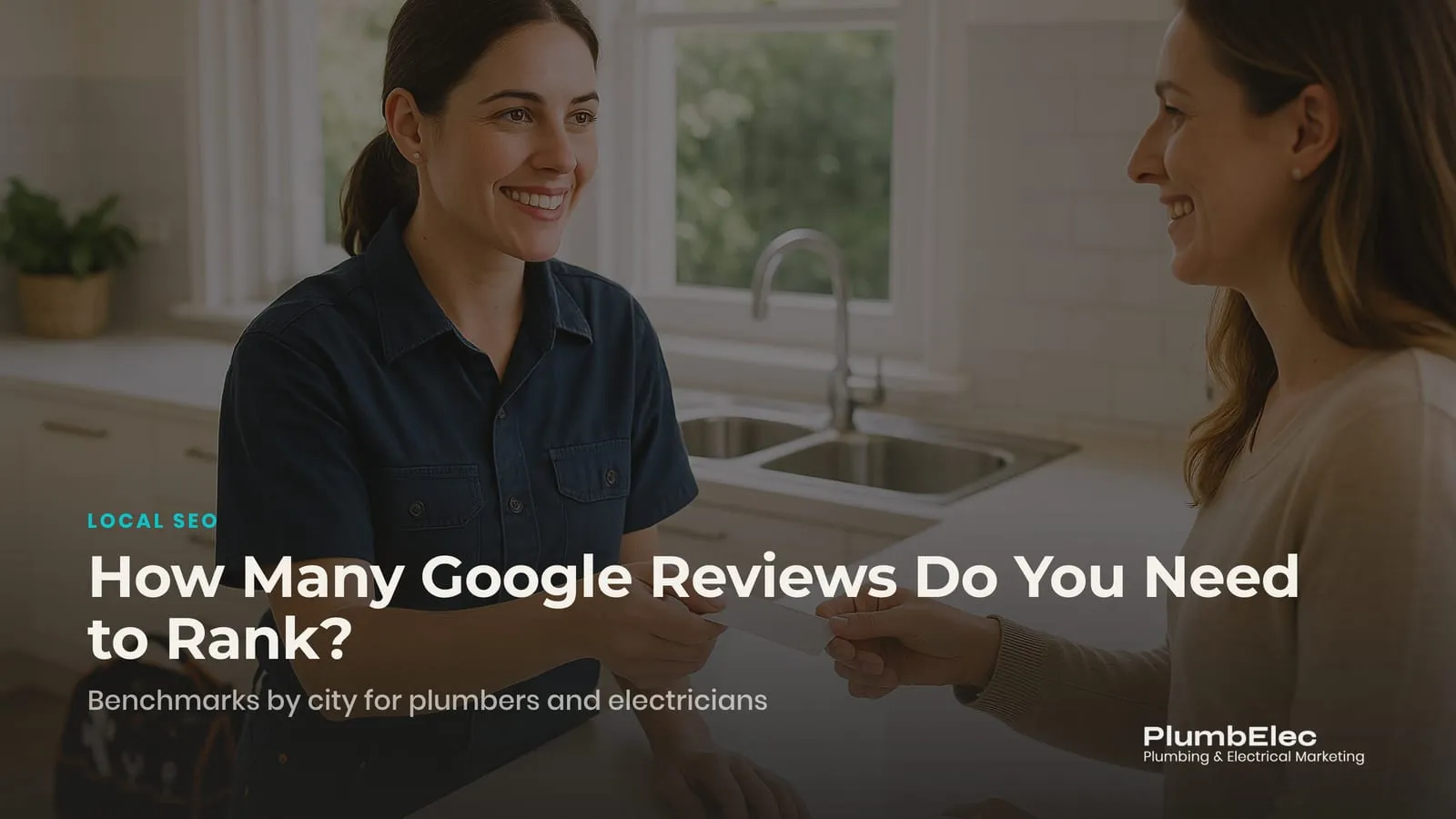 Plumber handing a homeowner a review card in a kitchen after finishing a job