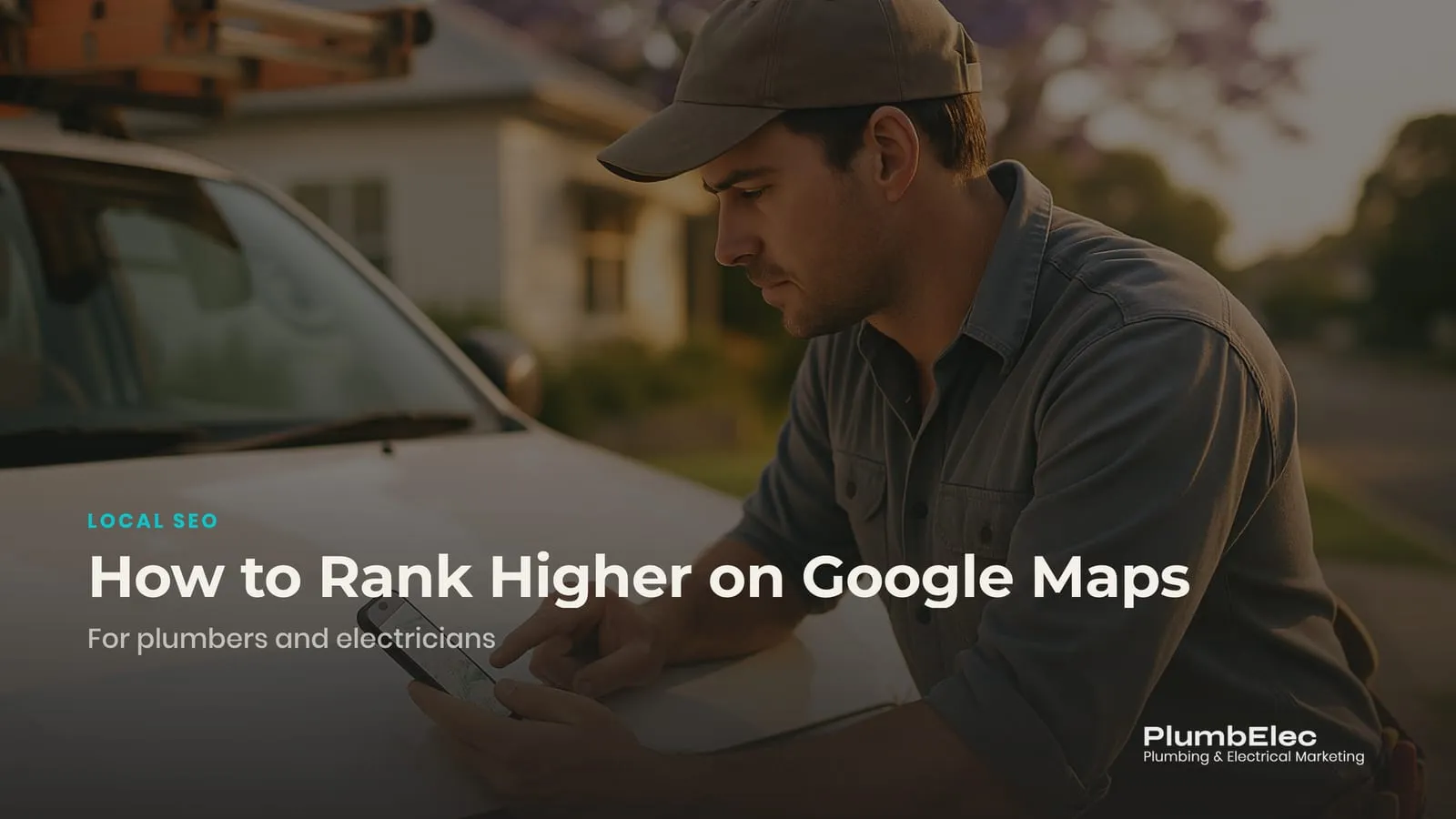 Electrician leaning on a work ute in a suburban street checking Google Maps on a phone