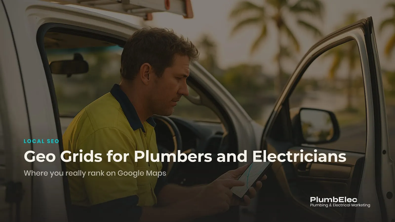 Electrician checking Google Maps results on a phone in the cab of a work ute on the Gold Coast